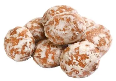 Prjaņiki ar dzērveņu garšas pildījumu sver.